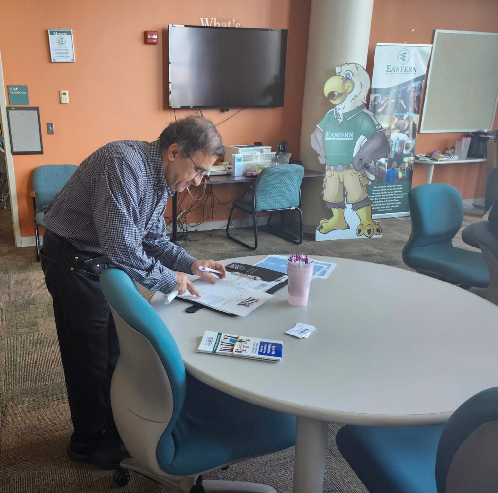 Photo of a man looking at papers.