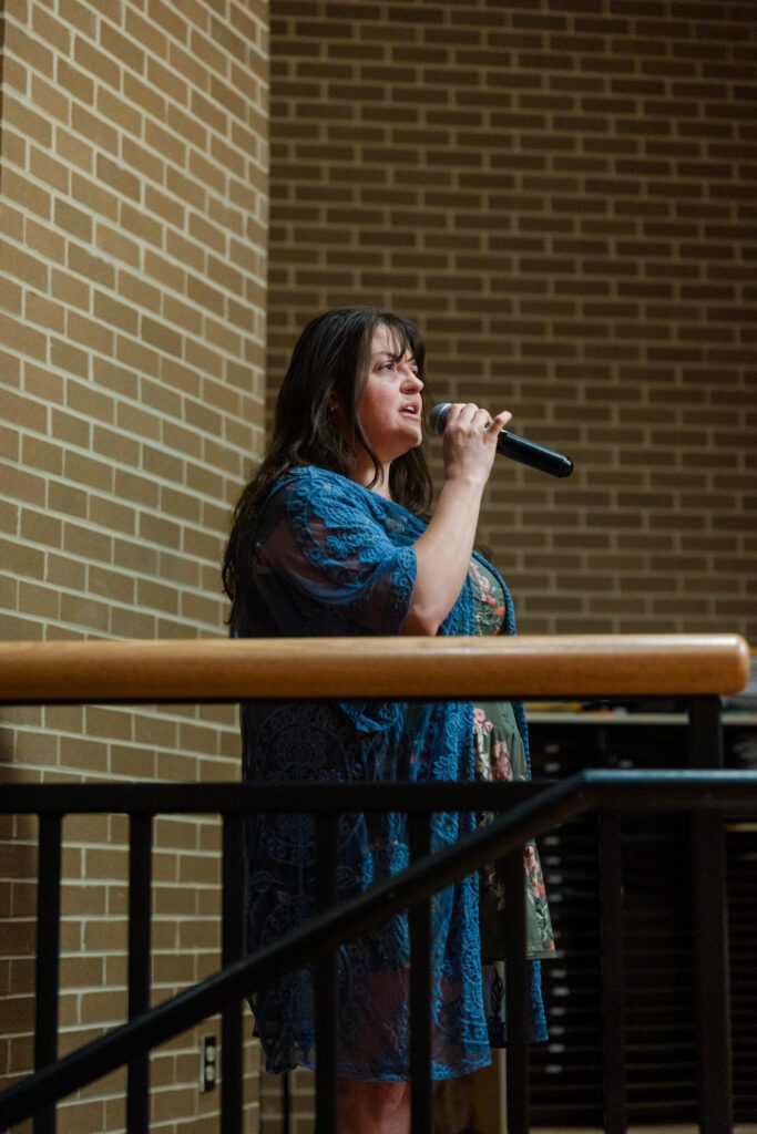Photo of Keira Ridgeway with microphone.