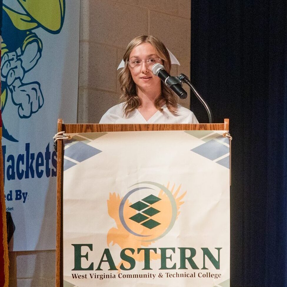 Photo of Madison Miller at podium.