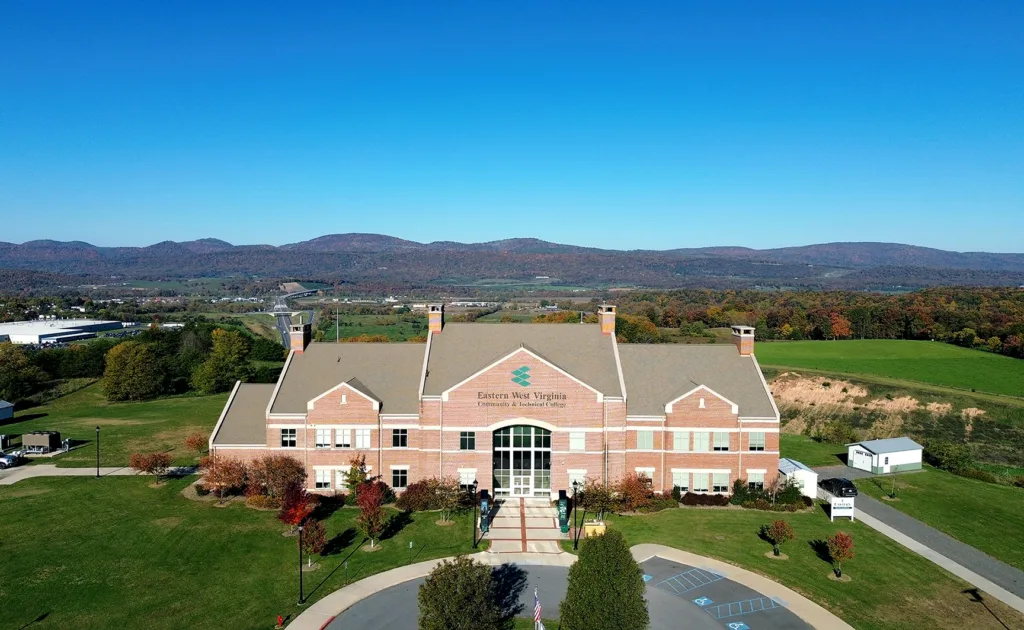 Aerial photo of Eastern WVCTC campus with the view of mountains behind the building.